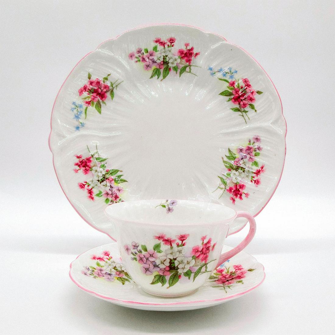 3pc Shelley England Oleander Tea Set Trio, Stocks: Vintage bone china tea wares; Oleander shape. Pink and blue floral motif with pastel pink rim. Shelley England backstamp. 13428 stamped on base. Cup size - 2.25"H x 3.75" diameter (widest). Sa