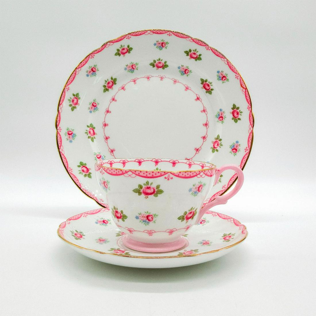 3pc Shelley England Tea Set Trio, Rosebud: Bone china tea set; Richmond shape. Pink rose pattern with pink scroll border. Gold gilt accents. Shelley England backstamp. 13510 hand-written on base. Cup size - 2.5"H x 3.5" diameter (wides