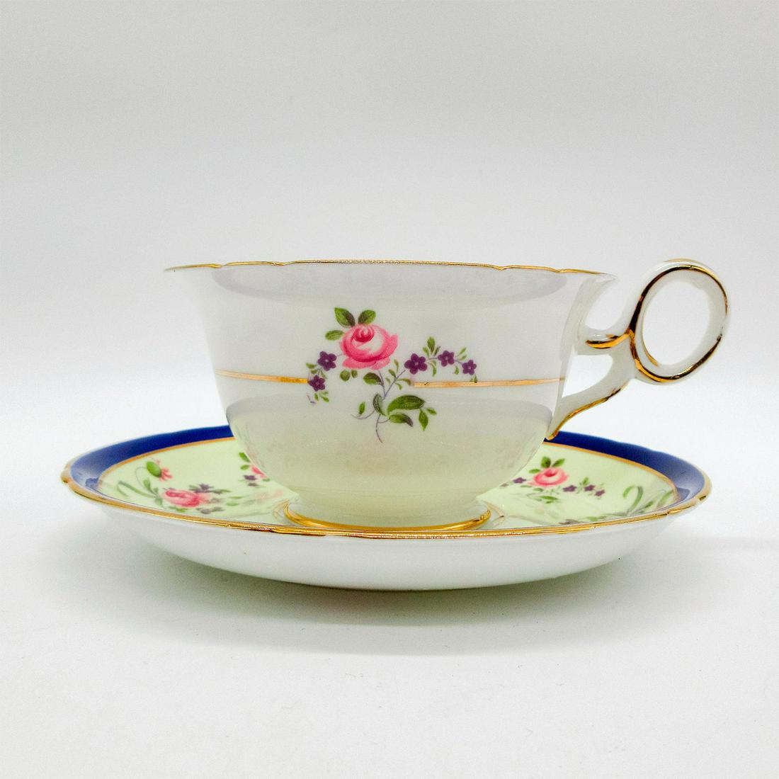 2pc Shelley England Cup and Saucer T0124/13: Chester shape. Pink and purple floral pattern with gold gilt accents. Ideal China Shelley backstamp. Cup size - 2.25"H x 3.75" diameter (widest). Saucer size - 0.75"H x 5.5" diameter. 