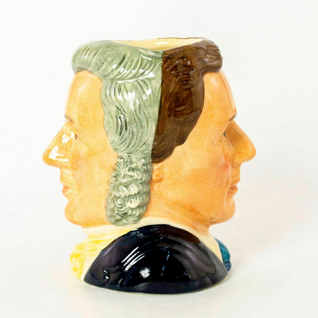 Sir Henry / Michael Doulton D6921 - Small - Royal Doulton Character Jug: Henry- Grey hair; yellow cravat; Michael- Brown hair; dark blue suit; white shirt; light blue tie. This two-faced jug was a special edition jug issued to mark Michael Doulton's personal appearances at