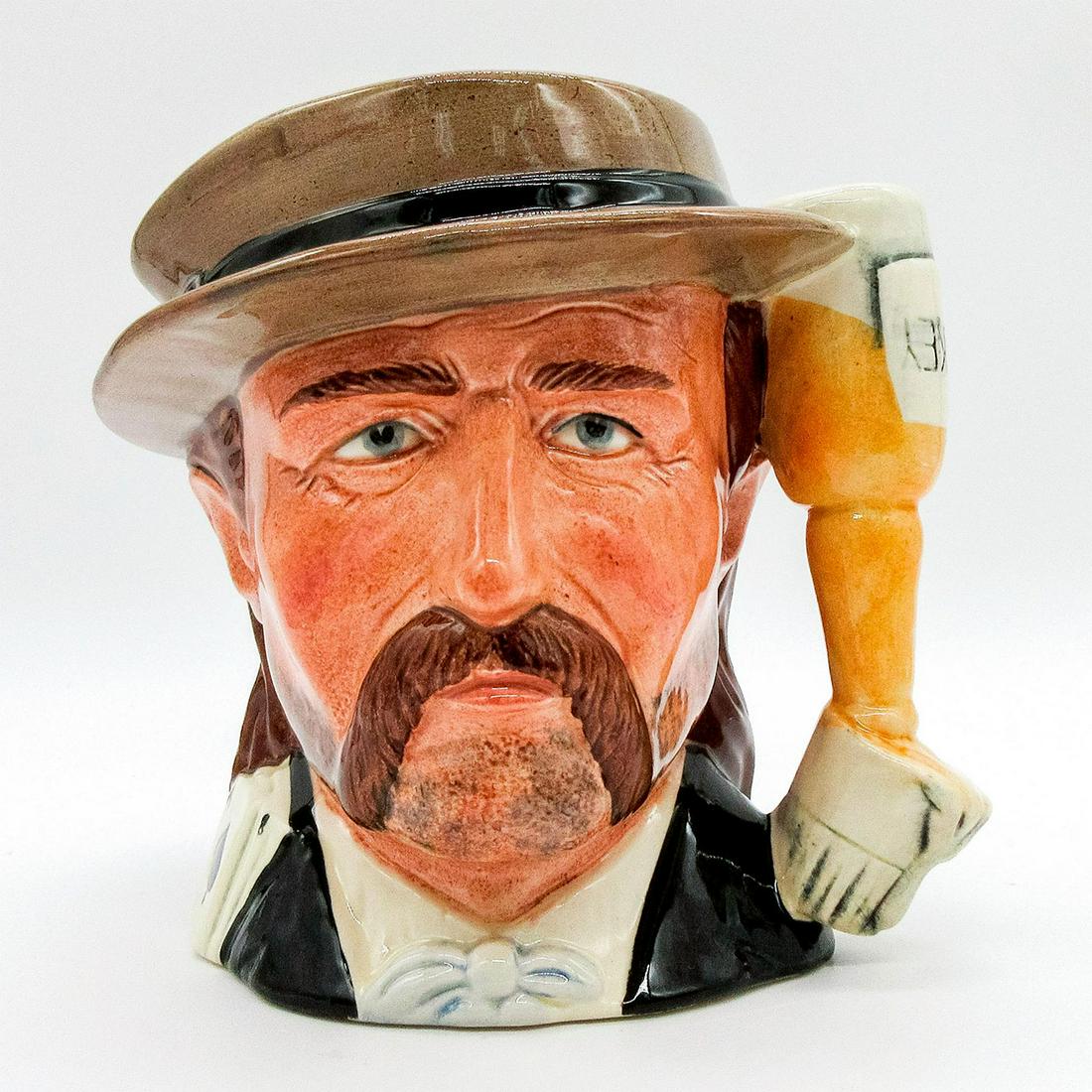 Wild Bill Hickock D6736 - Odd Size - Royal Doulton Character Jug: Black, brown and white coloration. After serving as a Union scout in the American Civil War, James Butler Hickock (1837 - 1876) became a marshal and then sheriff of several western frontier towns. An