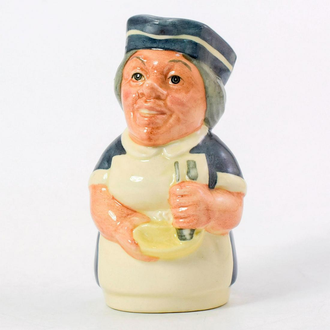 Miss Nostrum the Nurse D6700 - Royal Doulton Toby Jug: Royal Doulton Toby Jug, Miss Nostrum the Nurse D6700 (blue uniform; white apron; blue and white cap). Designed by William K. Harper. Series: The Doultonville Collection, issued 1983 - 1991. Size: 4''H