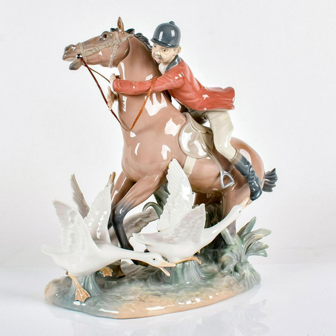 The Race 1001249 - Lladro Porcelain Figurine: Glossy porcelain. Lladro backstamp. Artist: Julio Fernandez Issued: 1974 - 1987 Dimensions: 13"H Manufacturer: Lladro Country of Origin: Spain