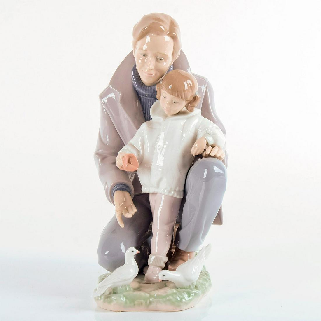 A Day with Dad 1006793 - Lladro Porcelain Figurine: Glossy finish. Dad and daughter in jackets, with birds. Lladro backstamp on bottom. Artist: Jose Luis Alvarez Issued: 2001-2010 Dimensions: 10.75"H x 8.25"W Manufacturer: Lladro Country of Origin: Spa