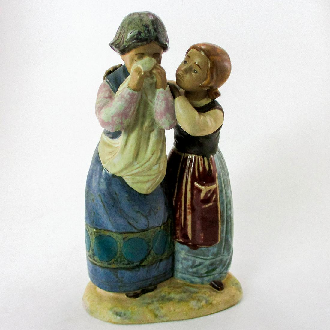 Comforting Her Friend 1011326 - Lladro Porcelain Figurine: Gres finish, Lladro backstamp. Artist: Julio Fernandez Issued: 1976-1983 Dimensions: 11"H Manufacturer: Lladro Country of Origin: Spain