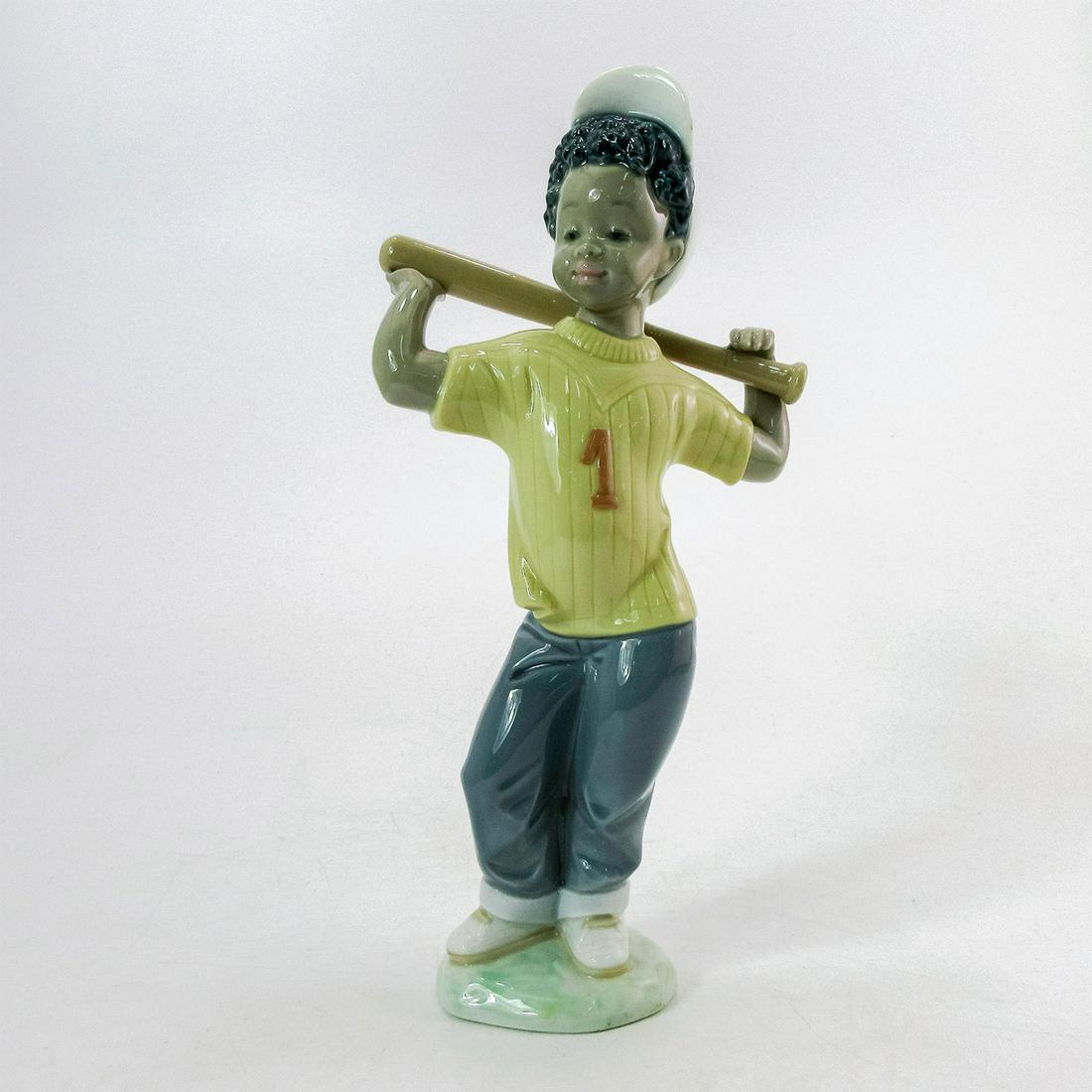 Next at Bat 1005828 - Lladro Porcelain Figurine: Glossy finish, Lladro backstamp. Artist: Josï¿½ Luis Alvarez Issued: 1991-1998 Dimensions: 9.25"H x 4"W Manufacturer: Lladro Country of Origin: Spain