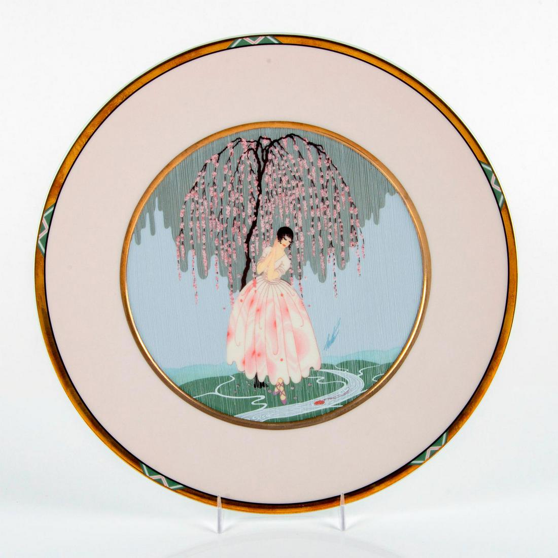 Mikasa Erte Bone China Charger, Blossom Umbrella UH203: Gold tone rim; portraying a woman using a cherry blossom to hide from the rain. Includes original box. Erte signature on front. Title and item number on back. Good condition. #mikasa #erte #plate #blo
