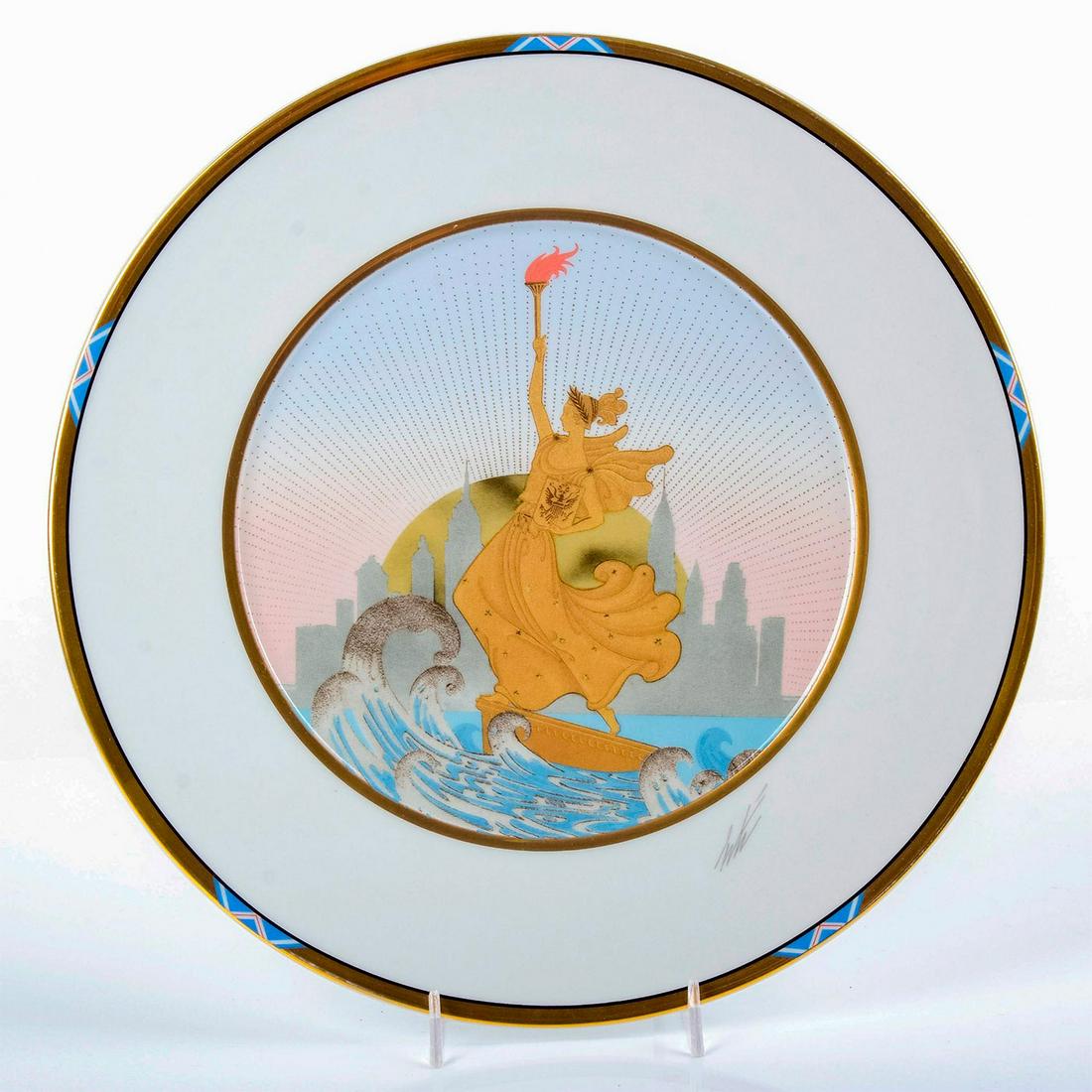 Mikasa Erte Bone China Charger, Statue of Liberty UH202: Gold tone rim; featuring a dramatic recreation of the Statue of Liberty amongst roaring waves. Includes original box. Erte signature below art. Title and item number on back. Good condition. #mikasa #