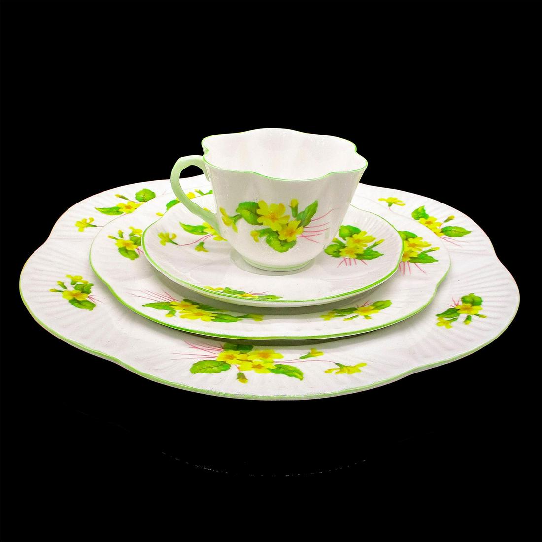 4pc Shelley England Tea Set, Primrose: The shape is Dainty and the pattern is the vibrant yellow Primrose with green rim. Fine Bone China Shelley England backstamp on all. The cup is 2.5"H. The saucer is 5.75"W. The salad plate is
