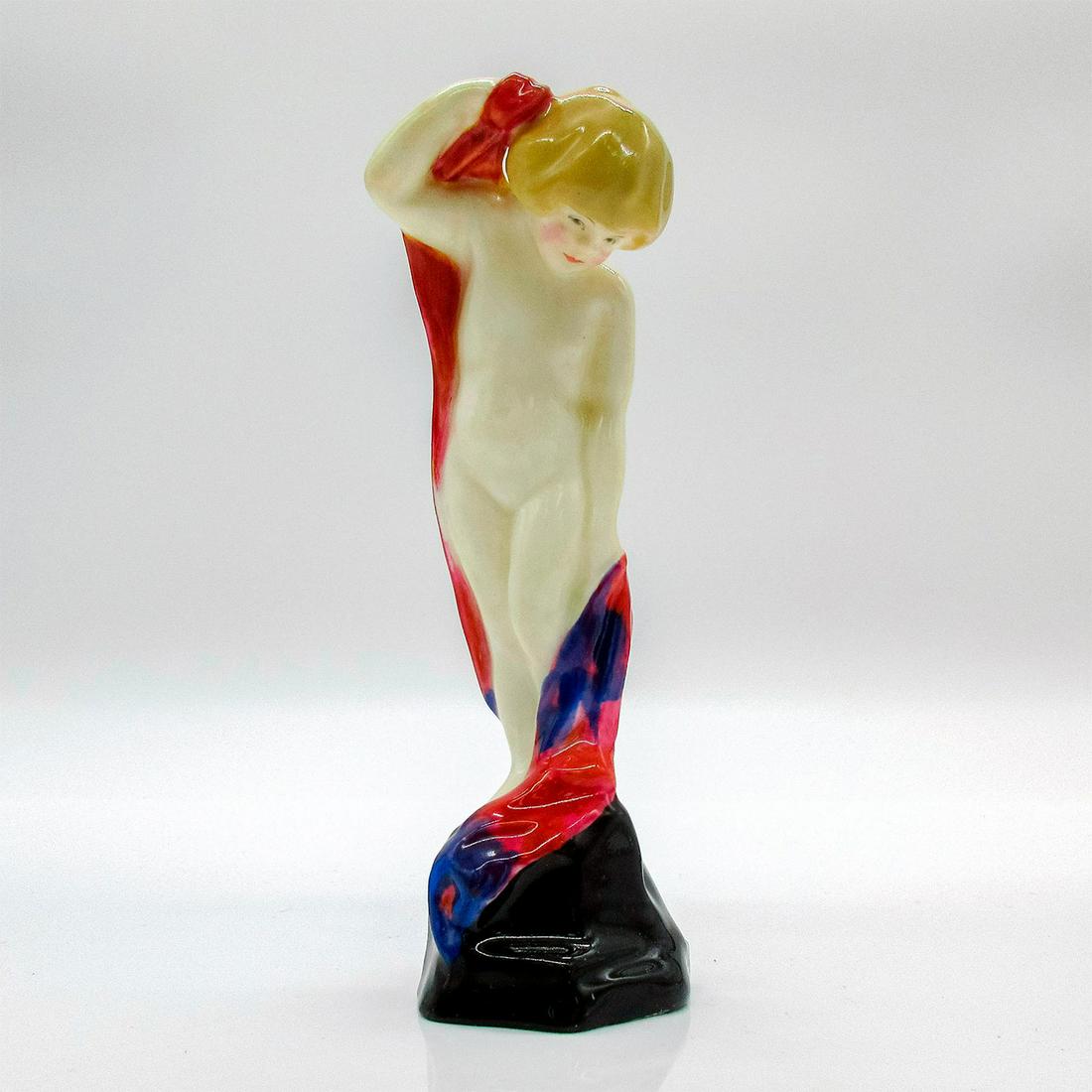 Sea Sprite HN1261 - Royal Doulton Figurine: Glazed, hand painted figurine. Child with a blanket draped on their back. Red, purple and black. Royal Doulton backstamp. Artist: Leslie Harradine Issued: 1927 - 1938 Dimensions: 5"H Manufacturer: Roy