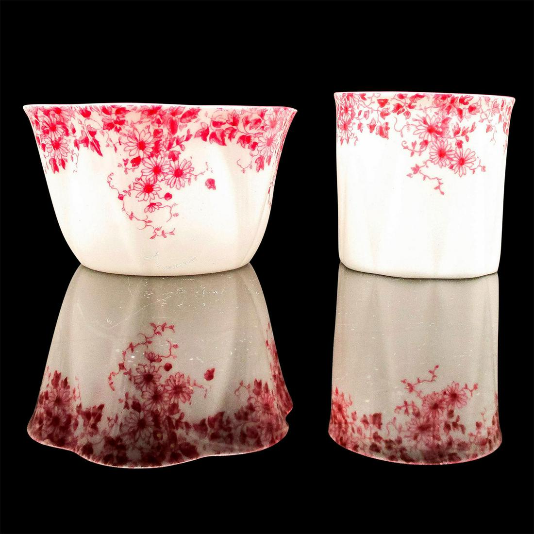 Shelley England Sugar Dish, Toothpick Holder, Dainty Pink: Delicate dark pink flowers on white. Fine Bone China Shelley England backstamp. Sugar dish 2"H x 3.25"W. Toothpick holder 2"H x 2.25"W. Issued: 1945-1966 Dimensions: 3.25"W x 2.25"H Manufacturer: Shel