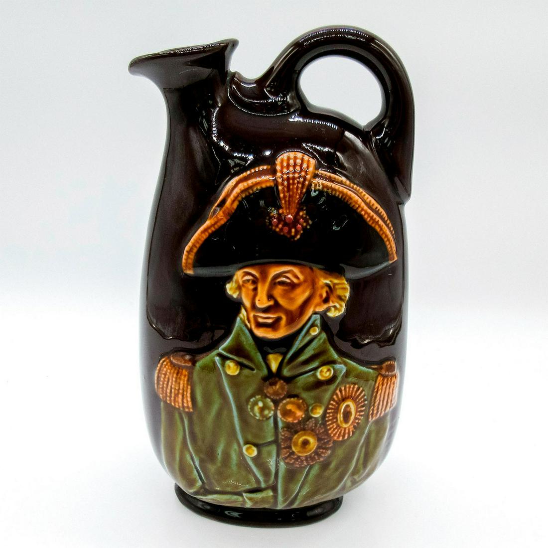 Royal Doulton Kingsware Dewar's Whisky Flask, Nelson: Deep rich brown glaze oviform flask; relief of Admiral Lord Nelson. British naval commander with crucial victories during the Revolutionary and Napoleonic wars. Incised Noke. Royal Doulton, and Dewar'
