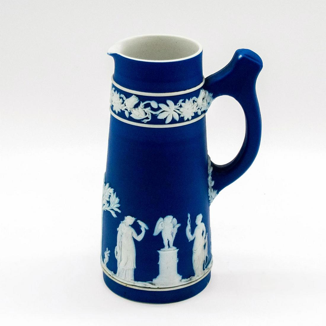 Wedgwood Jasperware Cobalt Blue Creamer Pitcher: Glazed interior; unique single handle; white relief floral and Grecian designs. Wedgwood impressed on base. Age related wear; minor staining and cracking throughout. #wedgwood #jasperware #pitcher Iss