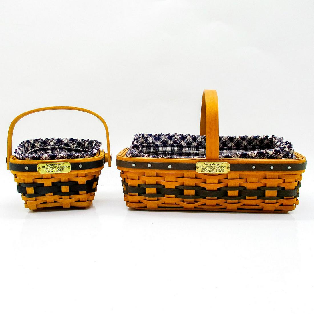 2 Longaberger Heirloom Mini Baskets, Gathering and Berry: Both handcrafted with fabric and plastic protective liners. Dated and factory mark to underside. Gathering basket 4.75"H x 7"W, includes Certificate of Authenticity. Berry basket 4"H x4"W, includes im