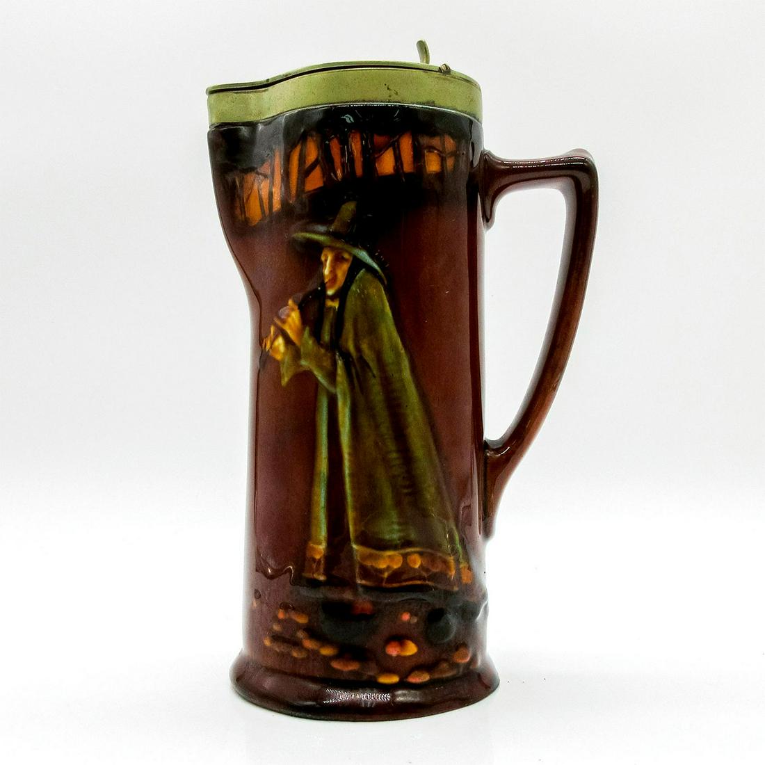 Royal Doulton Kingsware Tankard with Silver Plated Lid: Tall glazed tankard depicting a man in hat playing flute. Royal Doulton stamp on the base. #Tankard #RoyalDoulton Issued: 20th c. Dimensions: 7"H Manufacturer: Royal Doulton Country of Origin: England