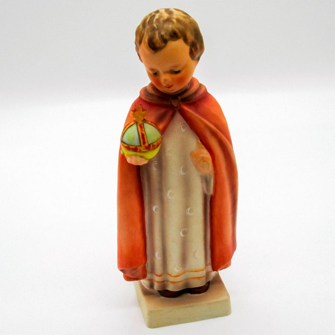 Goebel Hummel Figurine, Holy Child: Ceramic piece depicting child in robe holding a globe. #70. Goebel backstamp. #goebel #hummel #holychild Issued: 20th c. Dimensions: 7.25"H Manufacturer: Goebel Country of Origin: Germany
