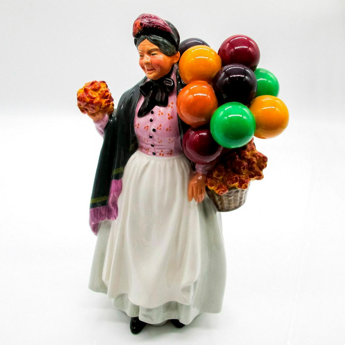 Biddy Penny Farthing HN1843 - Royal Doulton Figurine: Balloon Characters series. Royal Doulton backstamp. Artist: Leslie Harradine Issued: 1938 - 2009 Dimensions: 9"H Manufacturer: Royal Doulton Country of Origin: England