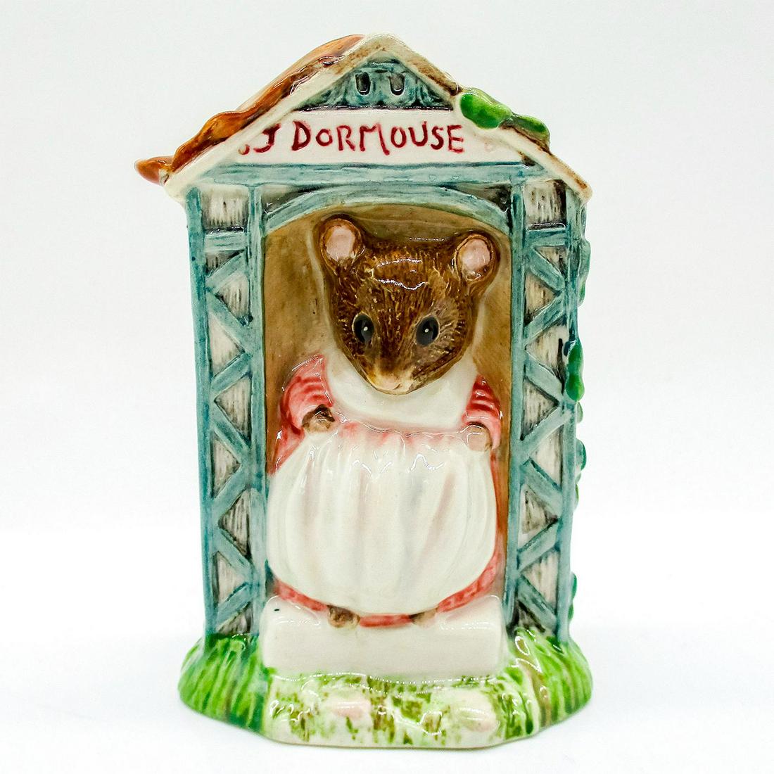 Miss Dormouse - Royal Albert - Beatrix Potter Figurine: Porcelain glazed figure of Miss Dormouse wearing a pink dress, white apron. Royal Albert backstamp. Issued: 1991 Dimensions: 4"H Manufacturer: Royal Albert Country of Origin: England