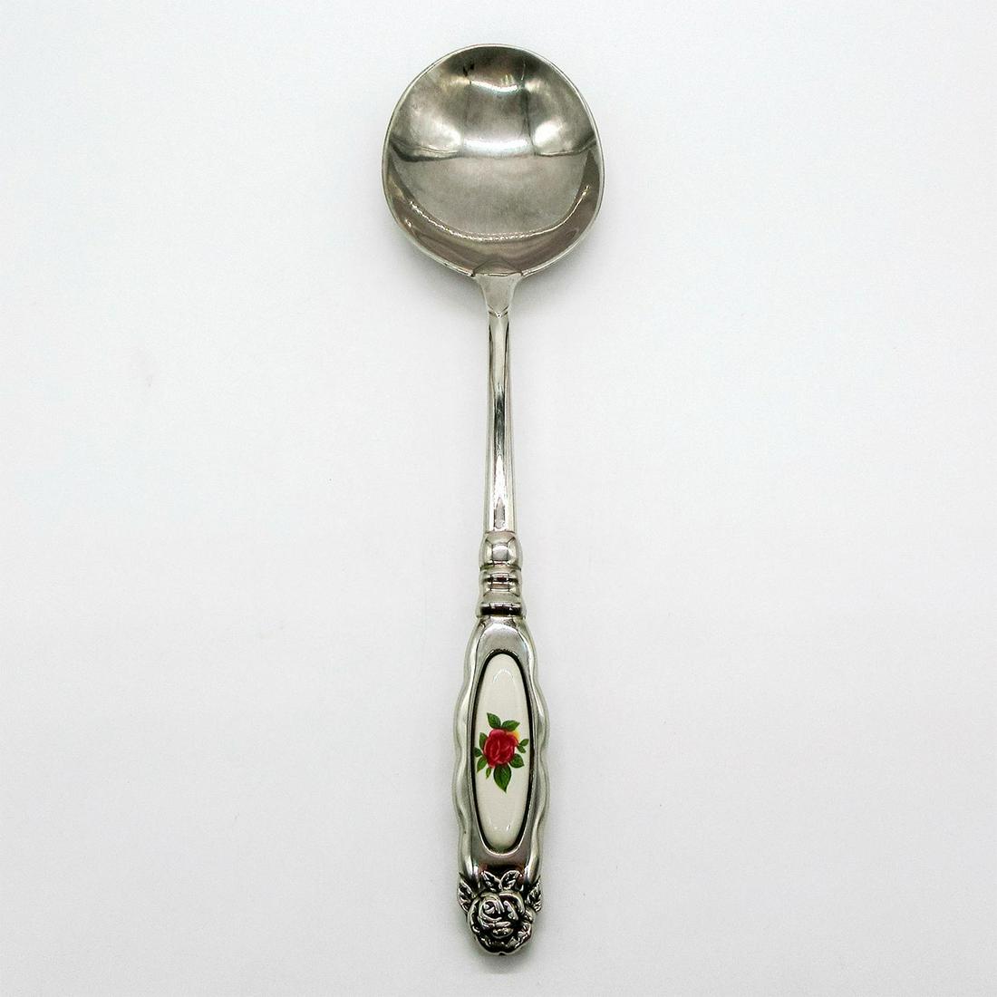 Royal Doulton Large Serving Spoon: Silver tone metal serving spoon; white ground with pink rose accent on handle. Royal Doulton stamped on metal. #serveware #spoon Issued: 20th c. Dimensions: 11.5"H Manufacturer: Royal Doulton Country