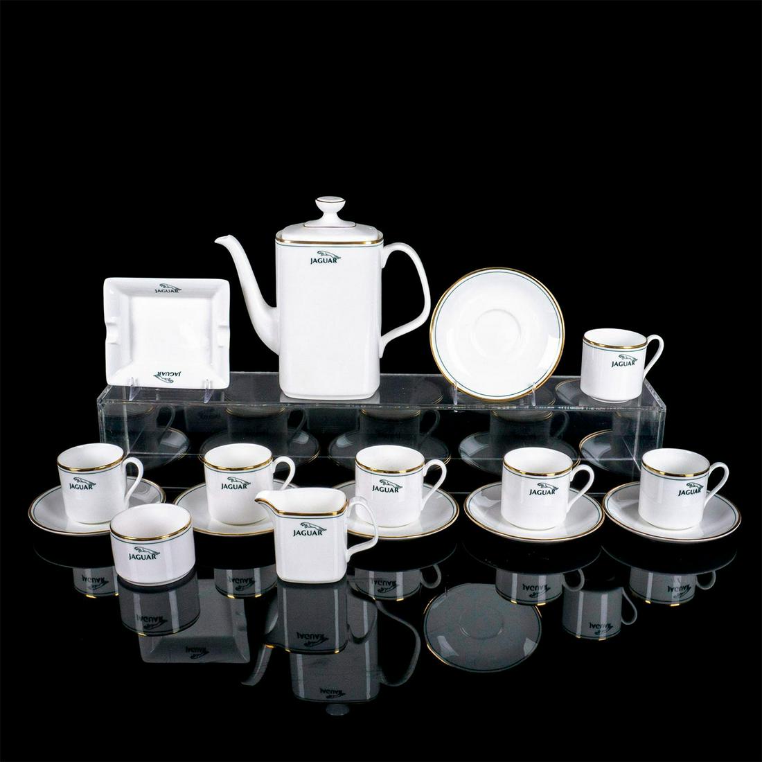 16pc Royal Doulton Bone China, Jaguar Branded Coffee Service: Jaguar car advertising coffee serving set; 1 coffee pot, 1 creamer, 1 open sugar, 1 ashtray, 6 cups and 6 saucers. Royal Doulton backstamp. Branded with Jaguar company logo and name with green thin ba