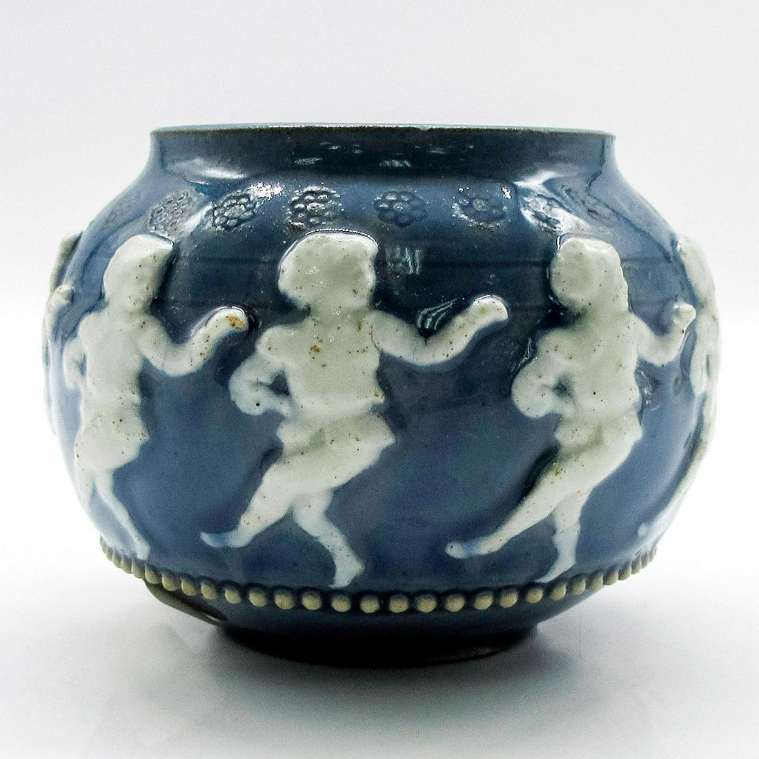 Royal Doulton Lambeth Miniature Bowl Dancing Children: Ringed with dancing children in relief. In blue and white. Glazed pottery. Royal Doulton backstamp. #England #Ashtray #Smoking Issued: 20th c. Dimensions: 3"H Manufacturer: Royal Doulton Country of Or