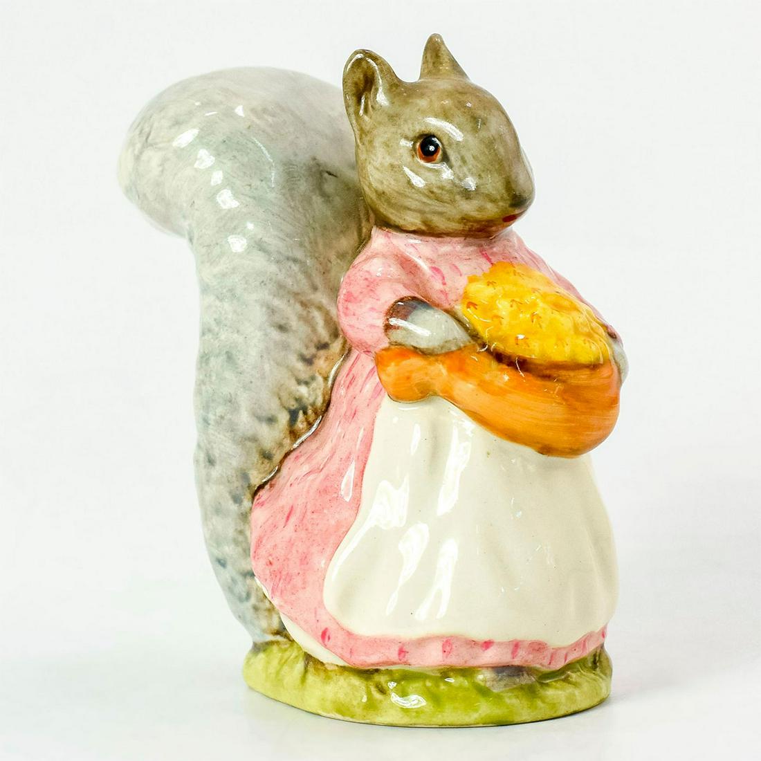 Goody Tiptoes - Beswick - Beatrix Potter Figurine: Grey squirrel wearing pink dress and white apron, brown sack with yellow nuts. Beswick backstamp. #beswick #beatrixpotter #figurine Artist: Arthur Gredington Dimensions: 3.5"H Issued: 1961 - present M