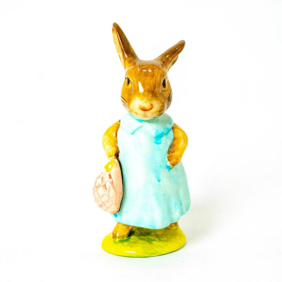 Mrs. Flopsy Bunny - Beswick - Beatrix Potter Figurine: Beswick Backstamp. Dark/ Light blue dress, pink bag. Artist: Arthur Gredington Dimensions: 4"H Issued: 1977 - 1982 Manufacturer: Beswick Country of Origin: England