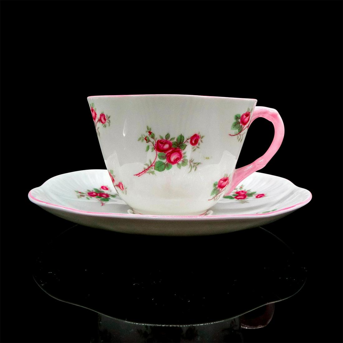 2pc Shelley England Cup and Saucer, Bridal Rose: Vintage bone china tea set; Dainty shape. Scattered pink rose design with pastel pink rim. Shelley England backstamp. 13545 stamped on base. Cup size - 2.5"H x 3.5" diameter. Saucer size - 0.75"H x 5.