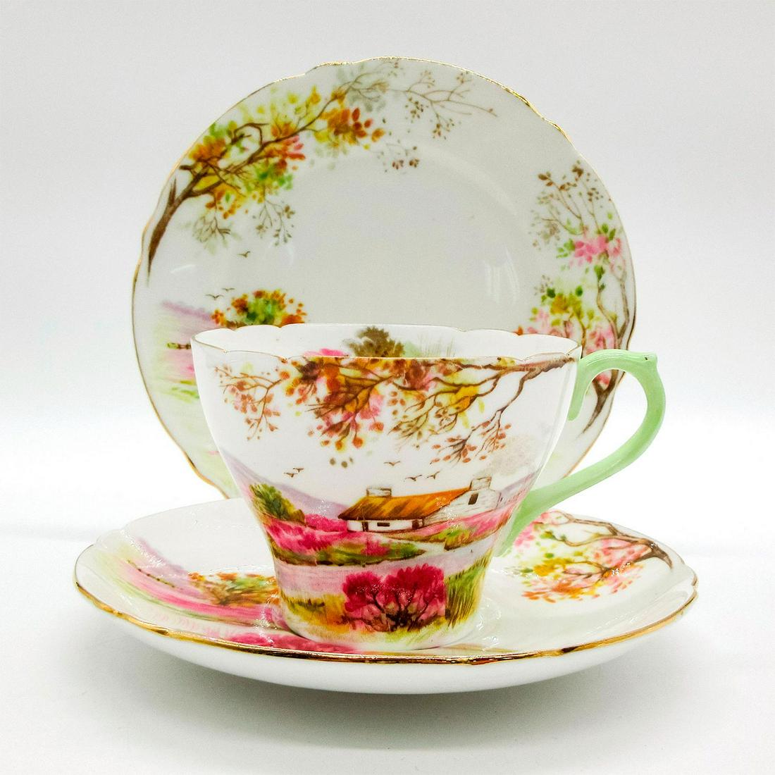 3pc Shelley England Tea Set Trio, Old Ireland: Vintage bone china tea set; Cambridge shape. Beautiful scenery of Irish countryside. Gold gilt accents. Shelley England backstamp. 13657 stamped on base. Cup size - 2.5"H x 3.5" diameter. Saucer size