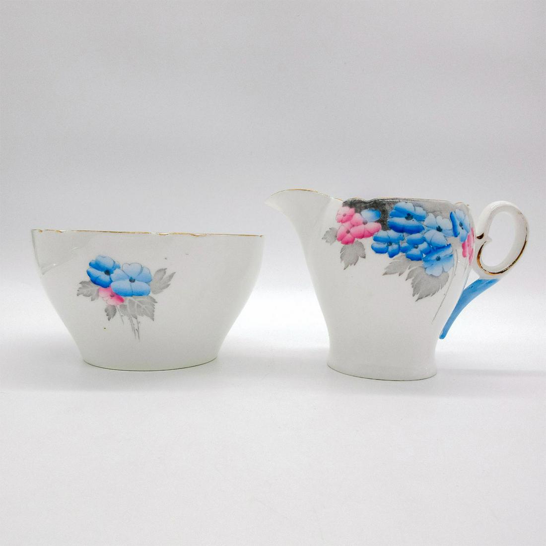 2pc Shelley England Creamer and Bowl, Blue Phlox: Vintage bone china large creamer and bowl. Pink and blue phlox flower pattern with gold gilt accents. Shelley England backstamp. 0170 hand-written on base. Creamer size - 3.5"H x 5.75"W. Bowl size - 2
