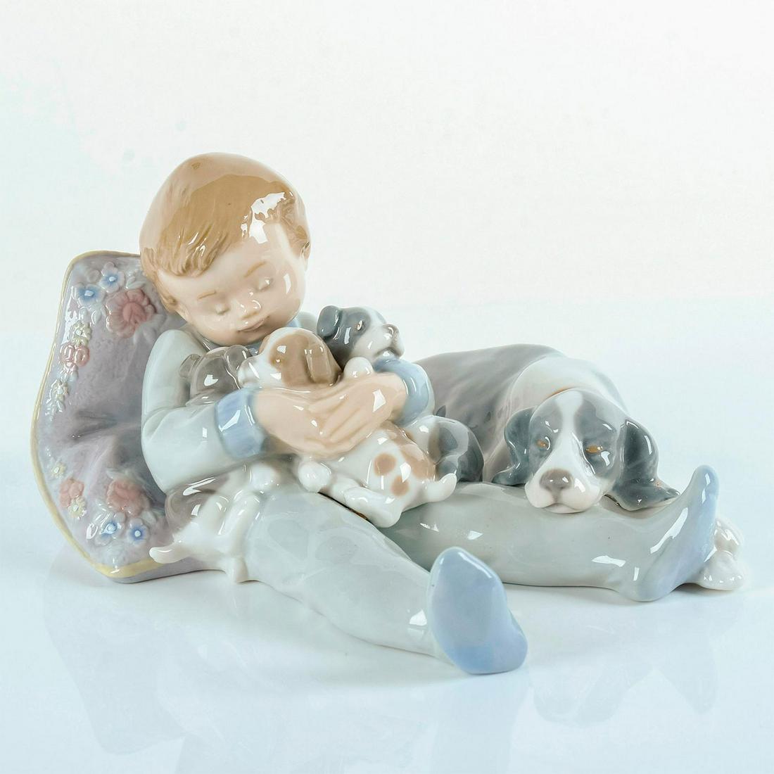 Sweet Dreams 1001535 - Lladro Porcelain Figurine: Glossy porcelain, includes original box. Lladro backstamp. Artist: Antonio Ramos Issued: 1998-2004 Dimensions: 3.5"H x 6.75"W Manufacturer: Lladro Country of Origin: Spain