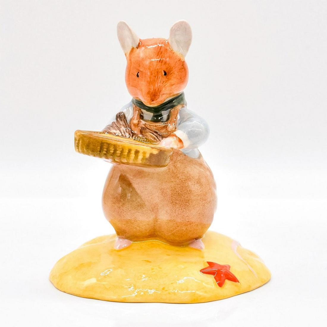 Mr. Saltapple DBH39 - Brambly Hedge Royal Doulton Figurine: Style Two. Series: Sea Story. Blue shirt, brown overalls and basket, green neckerchief. Royal Doulton backstamp. #royaldoulton #bramblyhedge Artist: Shane Ridge Issued: 2001 - 2002 Dimensions: 4"H Man