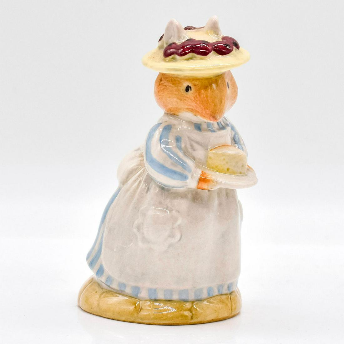 Mrs. Apple DBH3 - Brambly Hedge Royal Doulton Figurine: Style One. White and blue striped dress, white apron. Royal Doulton backstamp. #royaldoulton #bramblyhedge Artist: Harry Sales, David Lyttleton Issued: 1983 - 1997 Dimensions: 3.25"H Manufacturer: Roy