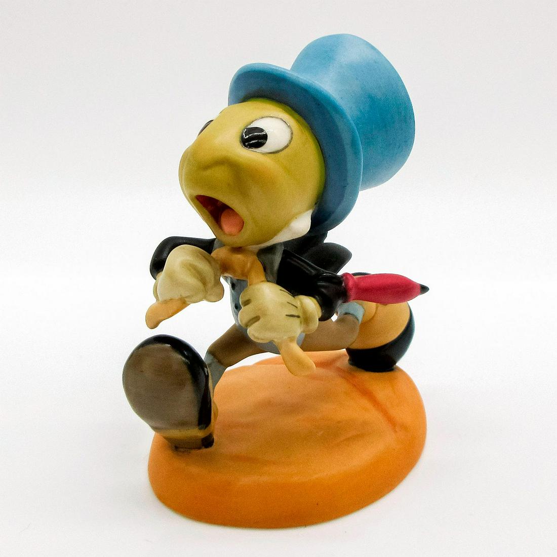 Jiminy Cricket, Wait for me Pinoke! - Walt Disney Classics Figurine: Small matte finish figure; Jiminy the Cricket rushing toward Pinocchio. Walt Disney Classics Collection backstamp. Comes with original box and Certificate of Authenticity. Box measurements; 3.75H x 5"