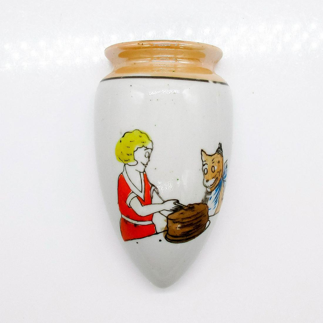 Famous Artists Syndicate Wall Pocket, Little Orphan Annie: Wall pocket with hand-painted illustration of Little Orphan Annie cutting a stack of pancakes for her dog. Rim has an iridescent glaze. Backstamp reads, Licensed by Famous Artists Syndicate. #Lustrewa