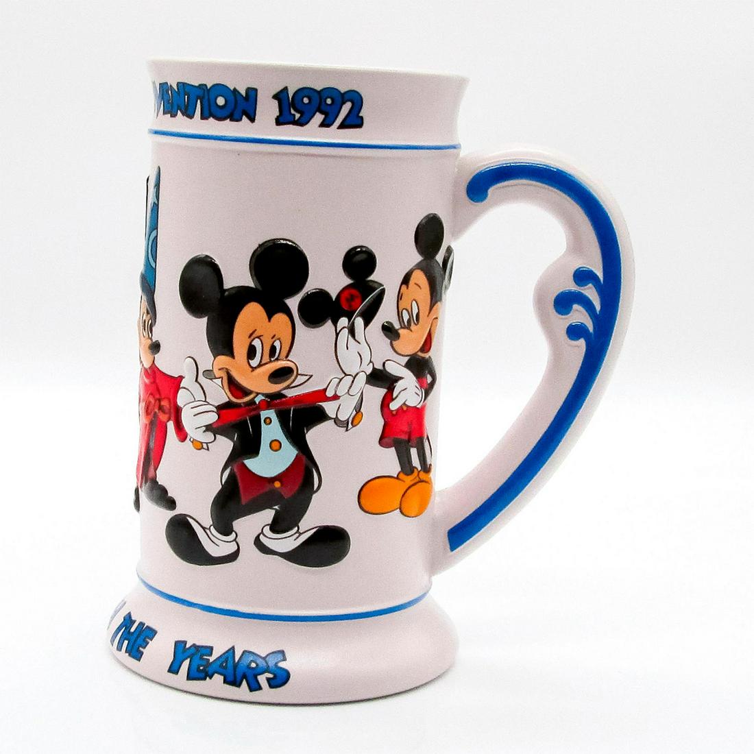Walt Disney World 1st Disneyana Convention Mug: Mickey Through The Years. Depicts 5 raised decoration images of Mickey Mouse. Disney backstamp. Comes in Original Box. Produced for the 1st annual convention, held at Disney's Contemporary Resort Sept