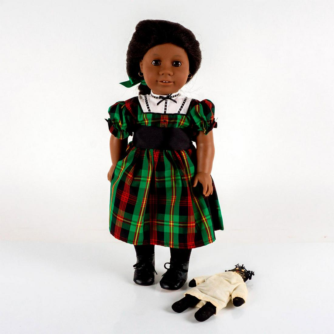 Pleasant Company, Inc. Doll, Addy's Christmas Story: Based on the character Addy from Connie Porter's "Addy's Surprise, A Christmas Story." From The American Girl Collection. Doll is featured wearing a green tartan dress with white collar and is accompa