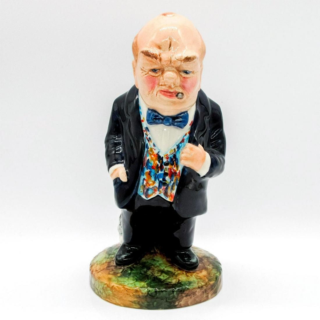 Bairstow Manor Prototype Figurine, Winston S Churchill: Glazed porcelain featuring famous prime minister, Winston Churchill, in navy blue suit and colorful vest.
