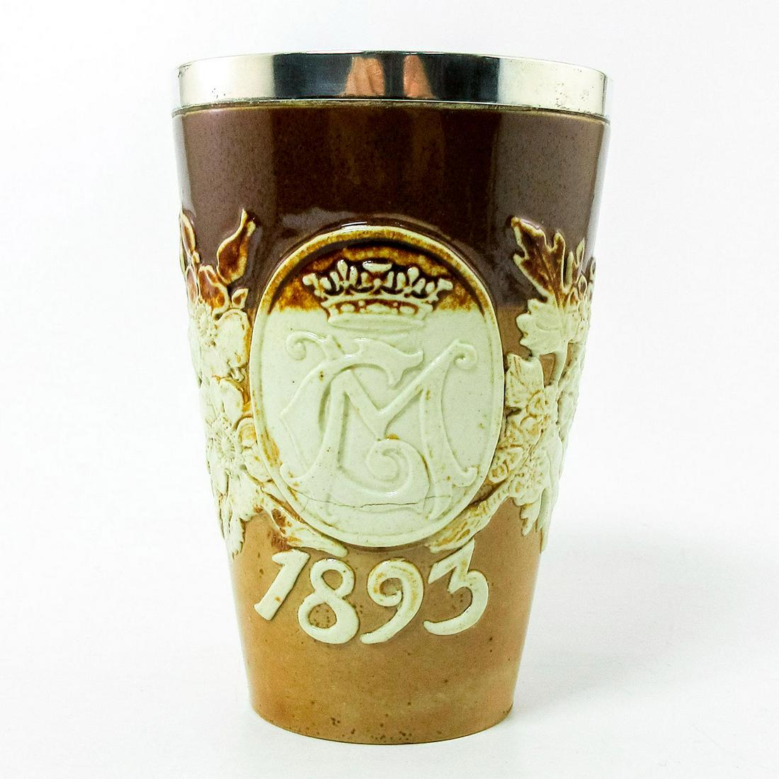 Doulton Lambeth Commemorative Stoneware Beaker, 1893: Two-toned stoneware for the marriage of Prince George and Princess Mary in 1893. Initials GM with flowers in relief.