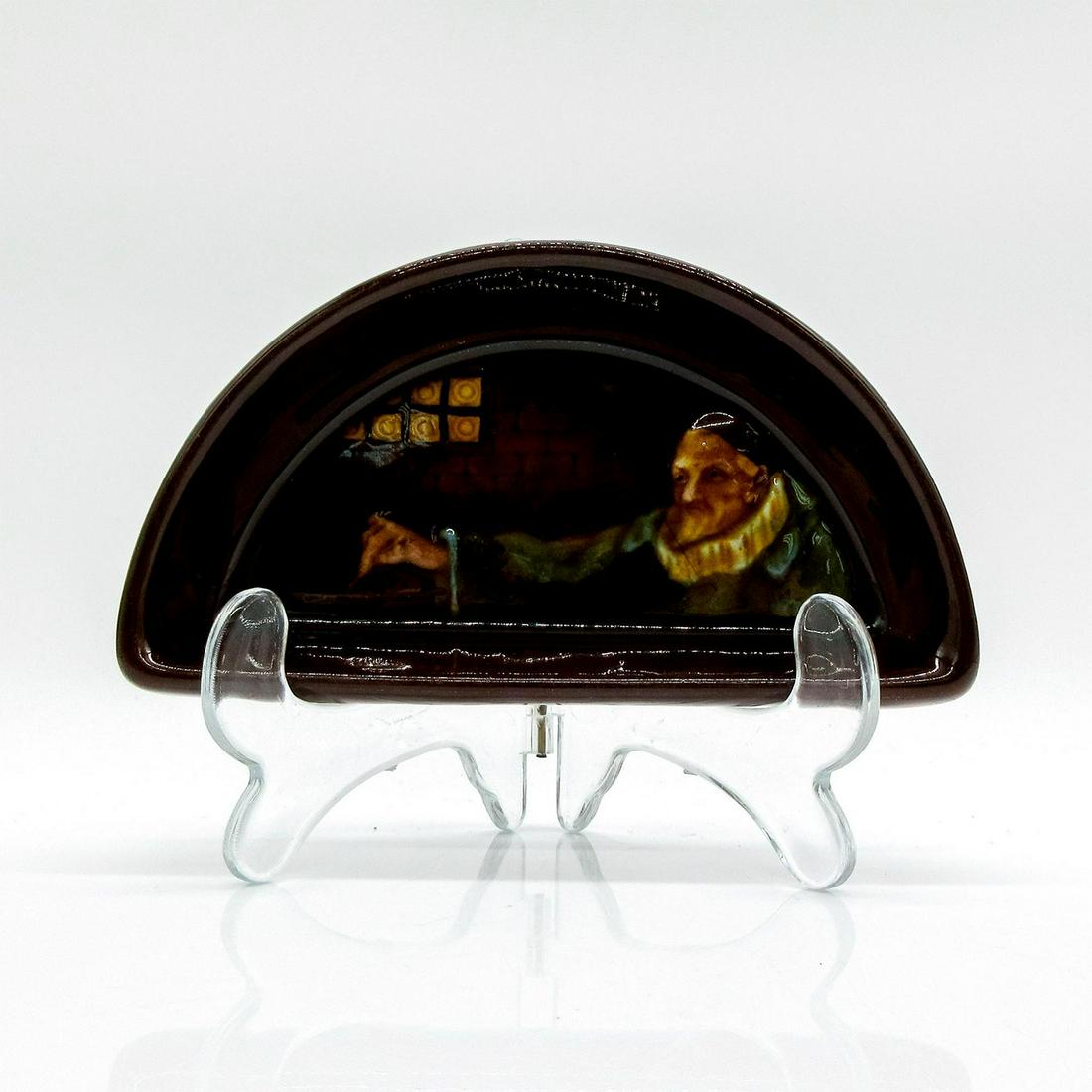 Ashtray, Alchemist - Royal Doulton Kingsware: Half moon shape. Rich, dark brown glaze; low relief of an alchemist pouring substance into cauldron.