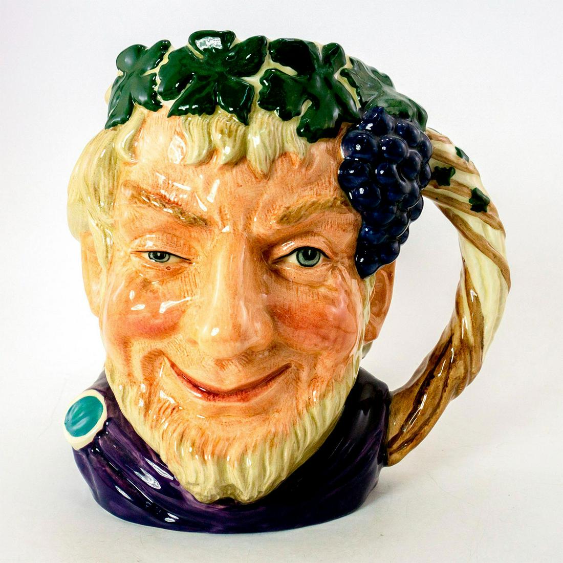 Bacchus D6499 - Large - Royal Doulton Character Jug: Maroon robes, green leaves and purple grapes adorn the head.