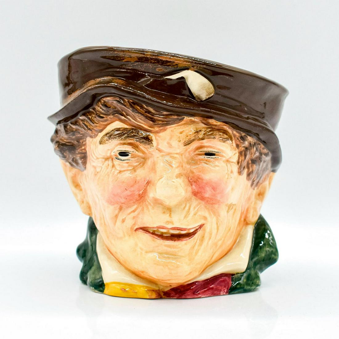 Paddy Tobacco Jar D5845 - Tobacco Jar - Royal Doulton: Brown hat; green coat; yellow and red scarf.