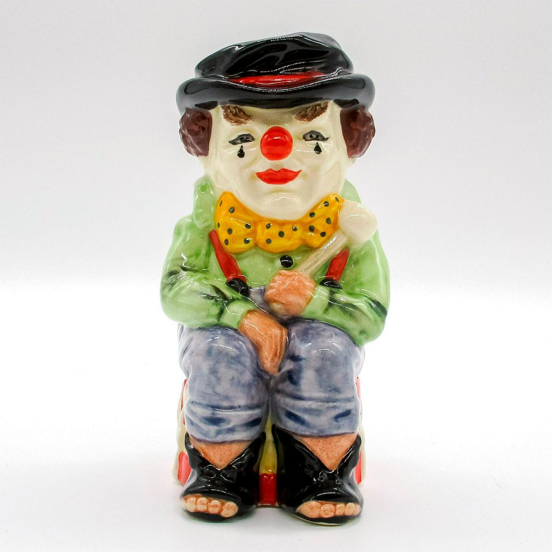 Clown D6935 - Royal Doulton Toby Jug: Green shirt; blue trousers; yellow bow tie with blue polka dots; yellow and red drum.