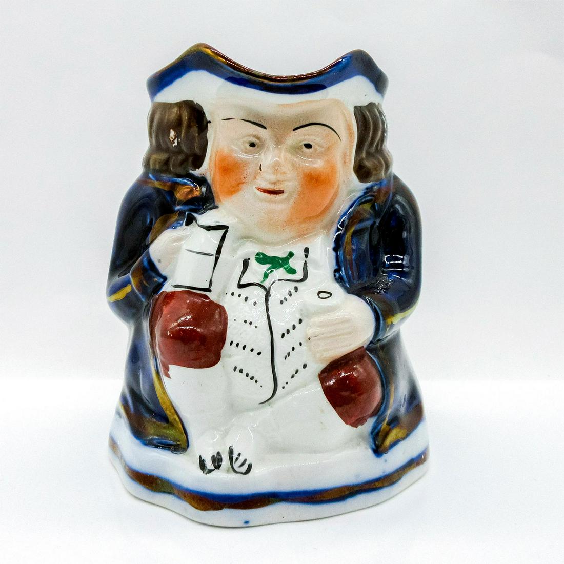 Allertons Porcelain Toby Jug, Man With Pint of Ale: A chap sits enjoying a pint of ale after a long day. In bright cobalt blue with bronze metallic paint accents.