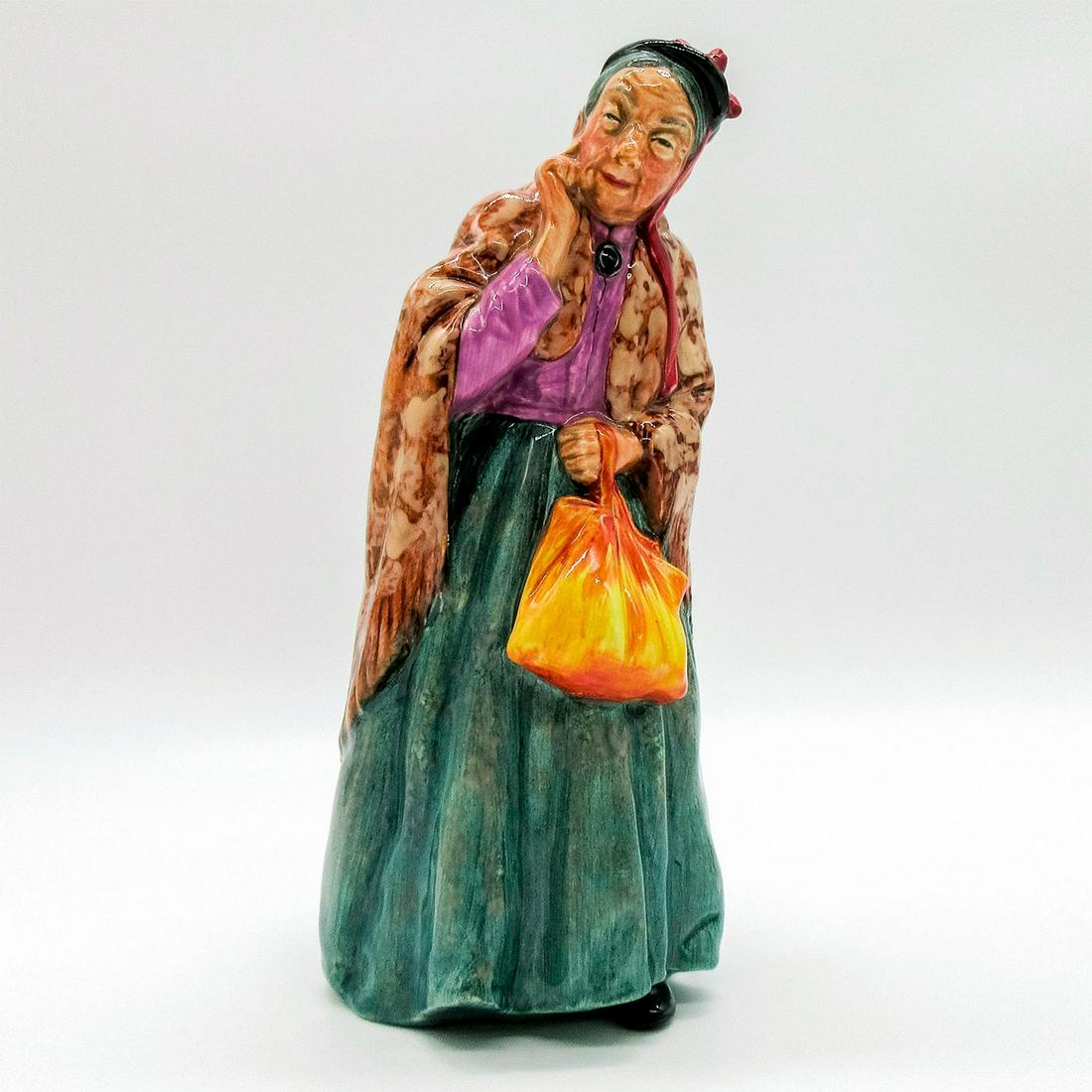 Bridget HN2070 - Royal Doulton Figurine: Sweet little Bridget with her shawl and handbag goes out for a stroll through the park. Series: Harradine Classics. Royal Doulton backstamp. Artist: Leslie Harradine Issued: 1951 - 1973 Dimensions: 7.