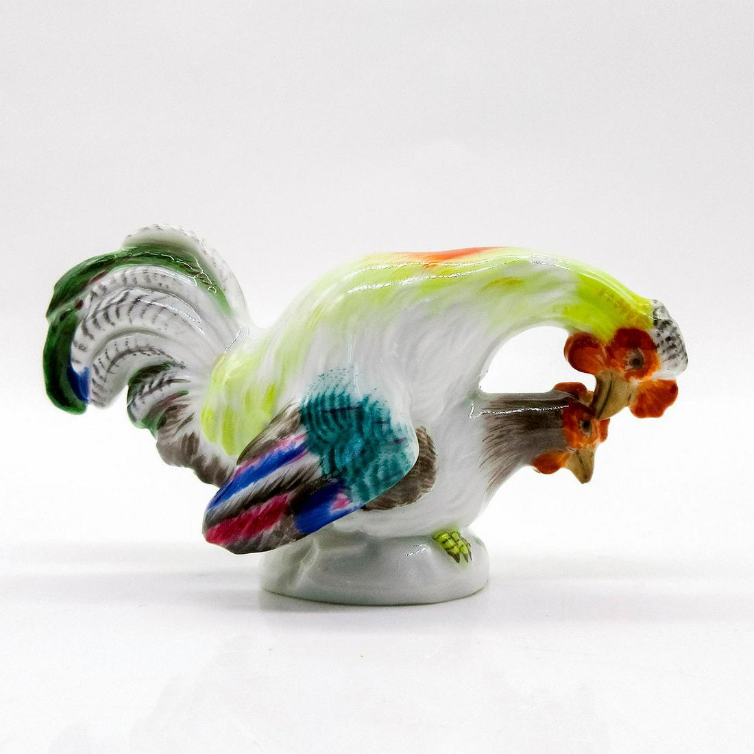 Meissen Porcelain Figurine, Mating Rooster and Hen: Mini glazed figure of a rooster with colorful wings and back mounted on a hen. Meissen backstamp. Issued: 20th c. Dimensions: 2"H Manufacturer: Meissen Country of Origin: Germany