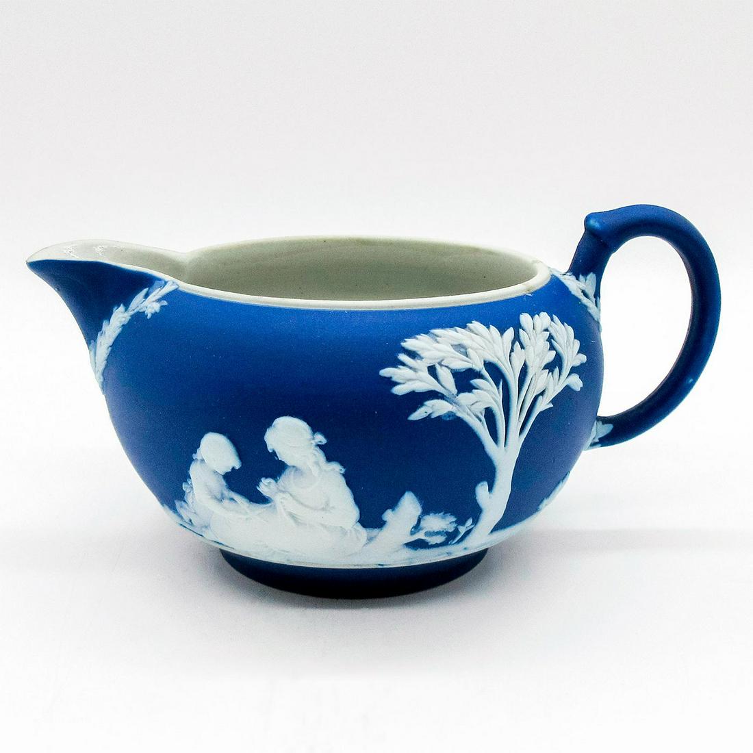 Wedgwood Portland Blue Jasperware Creamer: Portland blue ground with Neoclassical scenes encircling body in white relief. Impressed Wedgwood backstamp. #wedgwood #jasperware Issued: Early 20th c. Dimensions: 5"L x 3.75"W x 2.5"H Manufacturer: 
