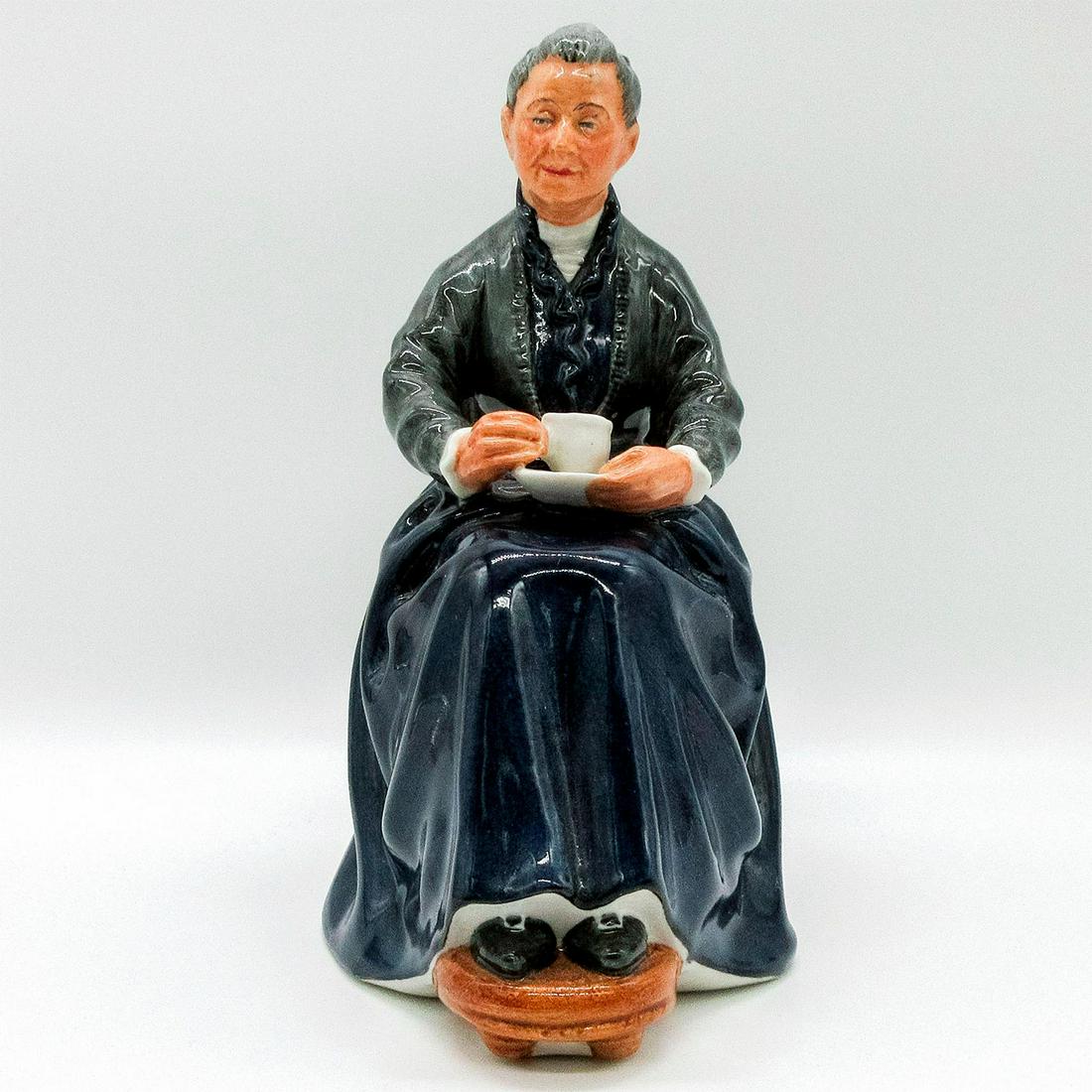 Cup of Tea HN2322 - Royal Doulton Figurine: Golden Years. Seated woman with a cup of tea. Doulton backstamp. Artist: Mary Nicoll Issued: 1964 - 1983 Dimensions: 7"H Manufacturer: Royal Doulton Country of Origin: England