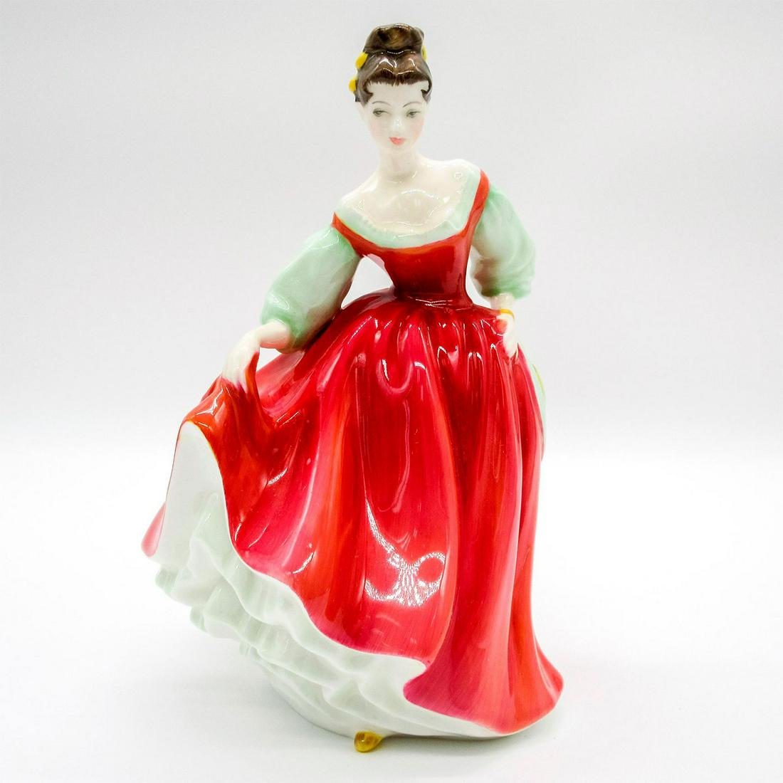 Fair Lady HN2832 - Royal Doulton Figurine: Porcelain glazed figurine; a beautiful woman in a red gown. This lovely piece was perhaps inspired by the heroine in the musical My Fair Lady, based on G.B. Shaw's Pygmalion. Since their inception in 