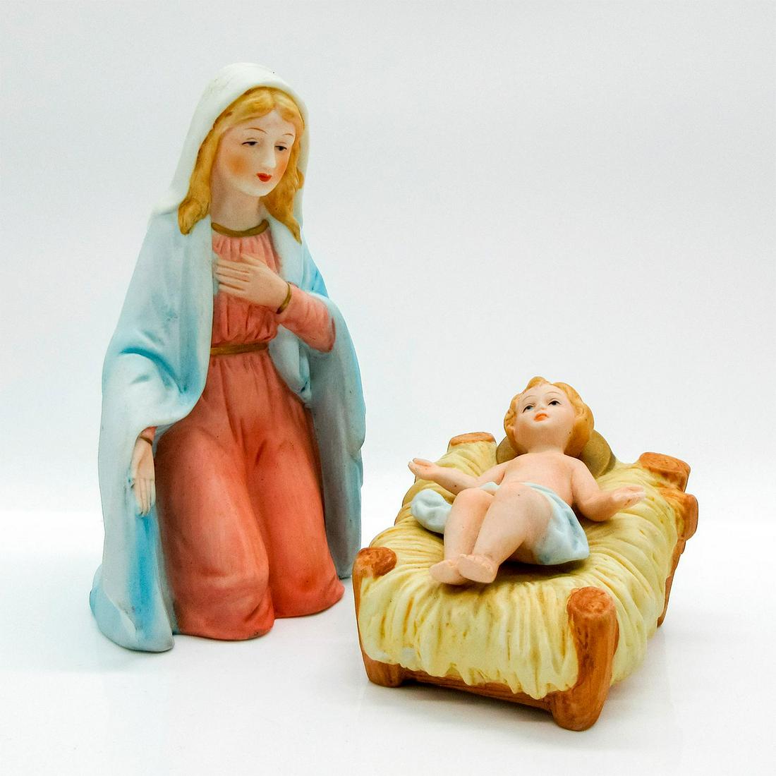 2pc HomCo Nativity Figurines, Baby Jesus and Mary: Matte finish figurines; feature baby Jesus laying on hay and smiling seated Mary. Home Interiors & Gifts Inc. backstamp. Baby Jesus size- 2.5"H x 3.5"L. Mary size - 5.75"H x 3.5"W. #nativity #Jesus #M
